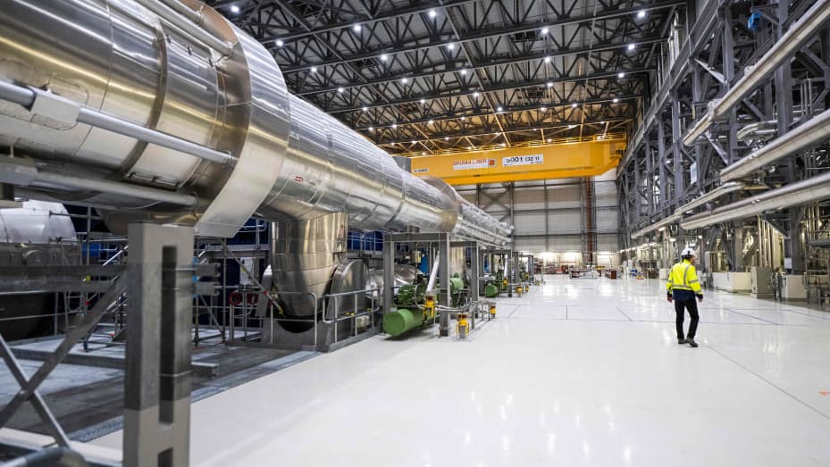 A worker walks at the turbine room linked to the OL3, the latest among three reactors at the nuclear power plant Olkiluoto on May 2, 2023, on the island of Eurajoki, western Finland. - Finland's next-generation Olkiluoto 3 nuclear reactor, the largest in Europe, has gone into regular production on April 16, 2023 after months of delays, hours after Germany ended its nuclear era. (Photo by Jonathan NACKSTRAND / AFP) (Photo by JONATHAN NACKSTRAND/AFP via Getty Images)