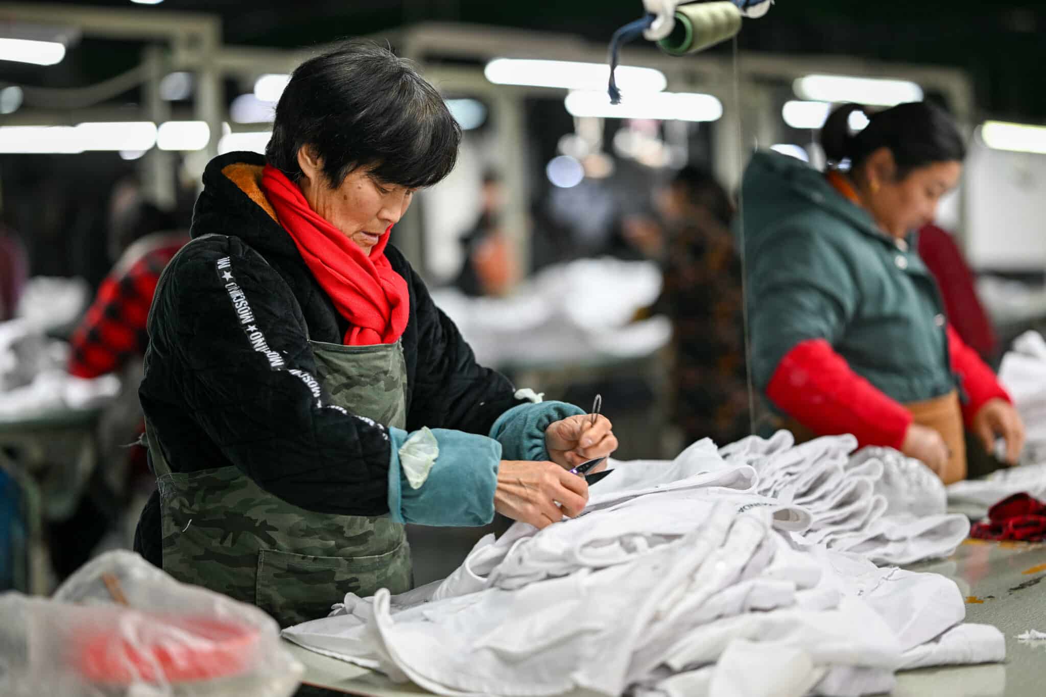 China PMI surprises as factory activity contracts in January; December industrial profits jump